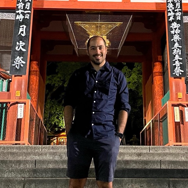 Mariano Matayoshi in front of the vermilion gate of Yasaka Shrine in Kyoto, Japan